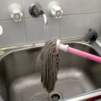 6.1 Wash mop in hot water.png