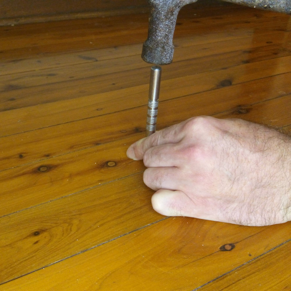 2.1 Punching nails back down.png