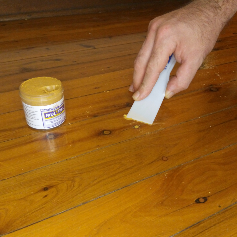 3.4 Applying putty to screw hole.png