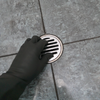 1.1 Removing the waste outlet grate.png