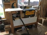 Quick clamp-on outfeed table