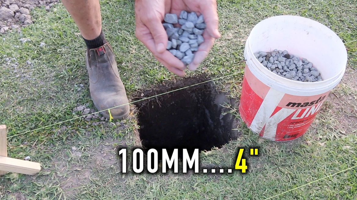 Adding 100mm of gravel to the bottom of the hole to encourage water to drain away from the bottom of the post
