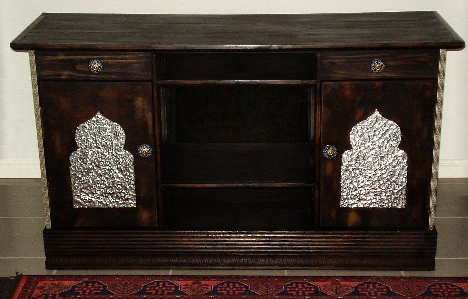 The first cabinet I made, which is mostly reused materials except for the hinges, knobs, stain, and adhesive.