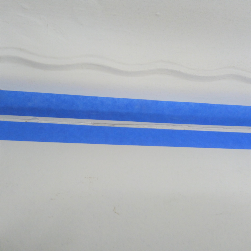 5.1 Applying tape to both sides of crack.png