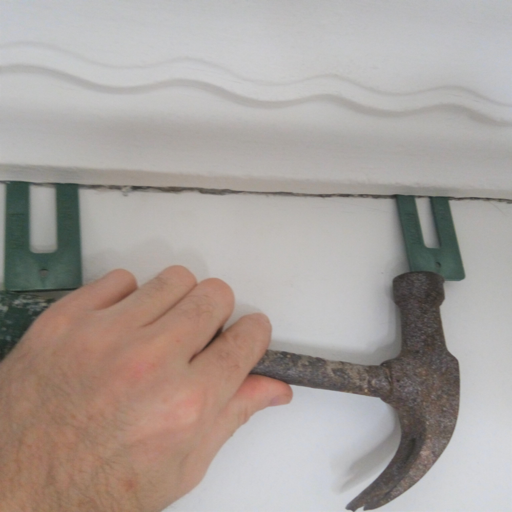 2.1 Tapping wedges into gap.png