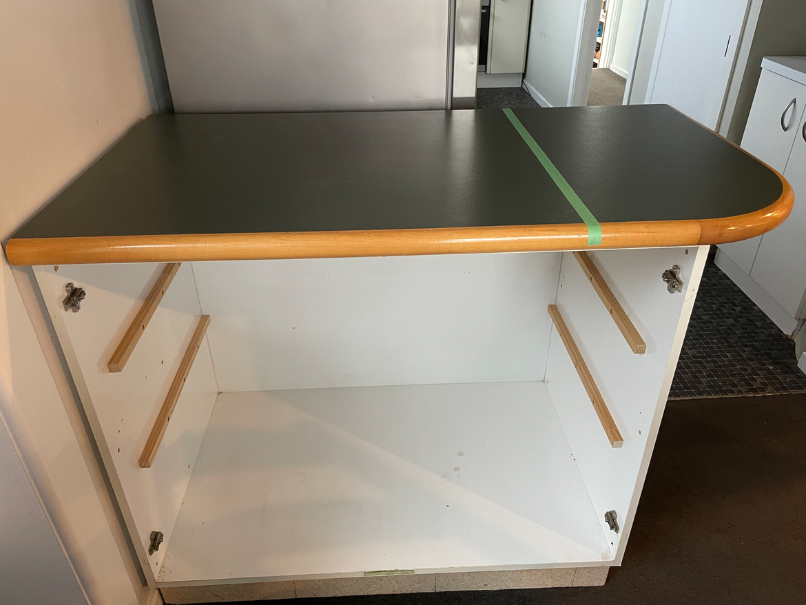 Removed shelves. Tape is to stop tearout