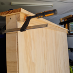 10.2 Install the trim piece below the top cover of the cabinet.png