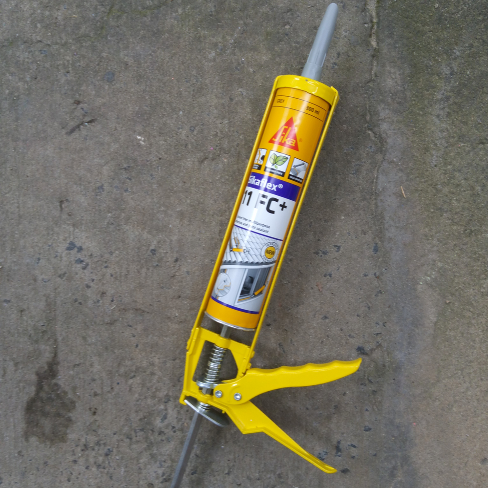 3.1 Inserting tube into caulking gun.png