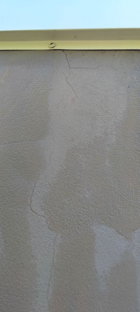 The wall dried and turned white around cracks