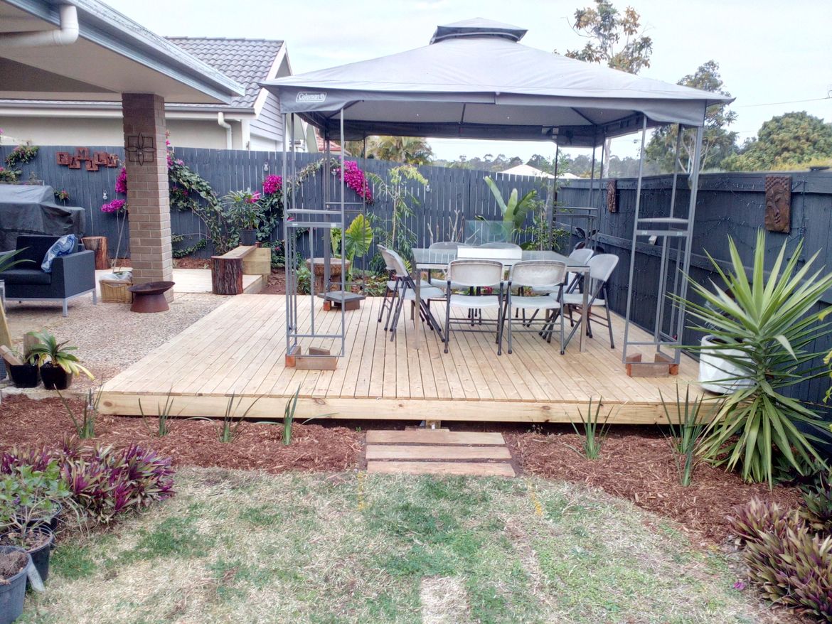 Looking alng the RHS of the house from the front fence to the side deck