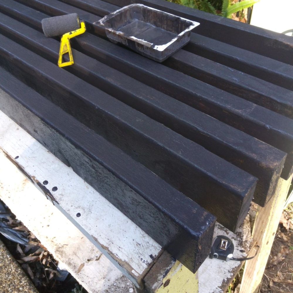 4.1 Painting bitumen sealer on frame and joist timbers.jpg