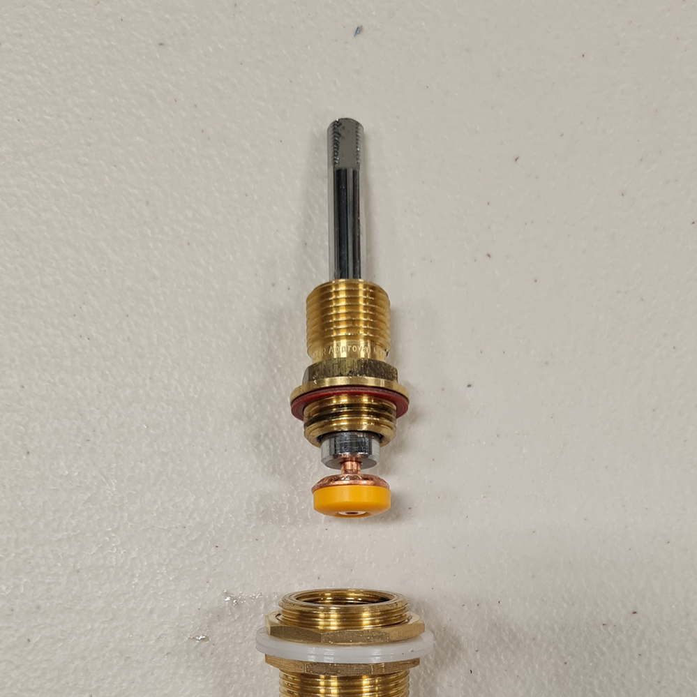 Step 5.6 Insert new tap valve at bottom of spindle and line up with tap base.png