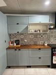 varnished benchtop and crazy splashback