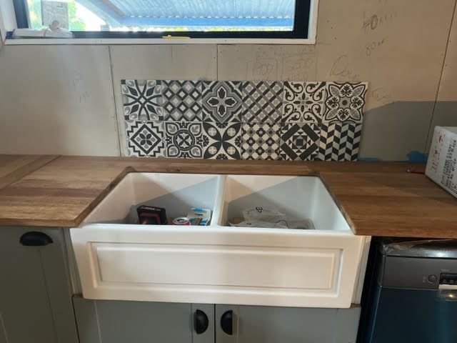 Farmhouse sink in and bench completed