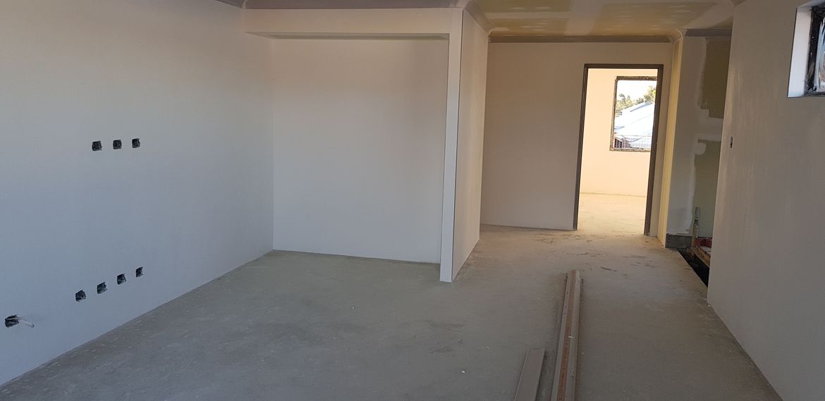 4.5 x 4.1m Retreat with fireplace. Opens onto Balcony.