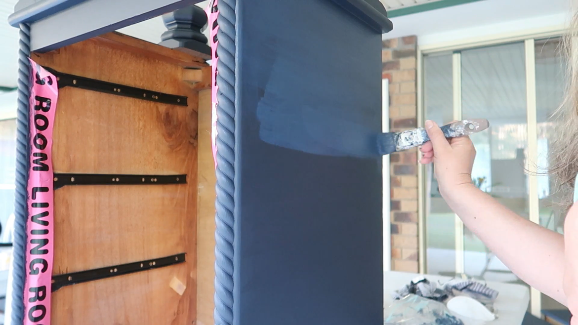 I proceeded to finish painting the whole piece, I gave it 4 coats in total as I never used a primer. One because I had sanded the crap out of it:) so there was a lot for the paint to stick too. Another reason was my paint was dark in color and so would not show up the wood as easily as if I had used a light color paint.