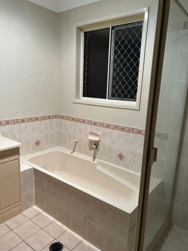 Beige tiles and dated feature tiling