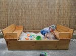 Sandpit with fold-out seats