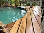 Make sure that the ground is sloped and has proper drainage so water will not pool under the deck.