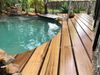 Make sure that the ground is sloped and has proper drainage so water will not pool under the deck.
