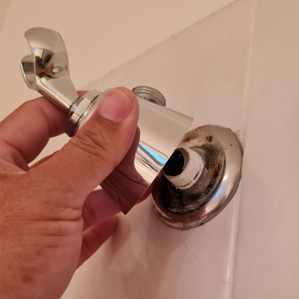 Step 3.2 Line up wall mount holder to brass nipple.png