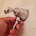 Step 4.3 Nut-shaped end of hose to wall mount holder.png