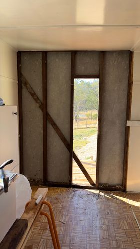 Interior masonite wall and window removed.