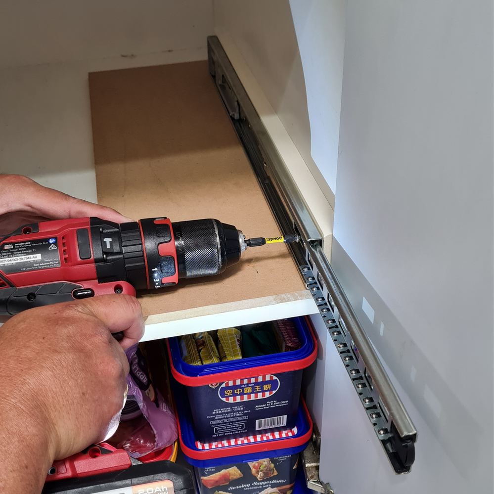 5.3 Screw drawer runner to cabinet.png