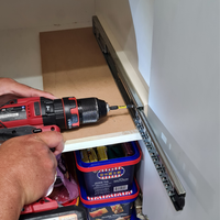 5.3 Screw drawer runner to cabinet.png