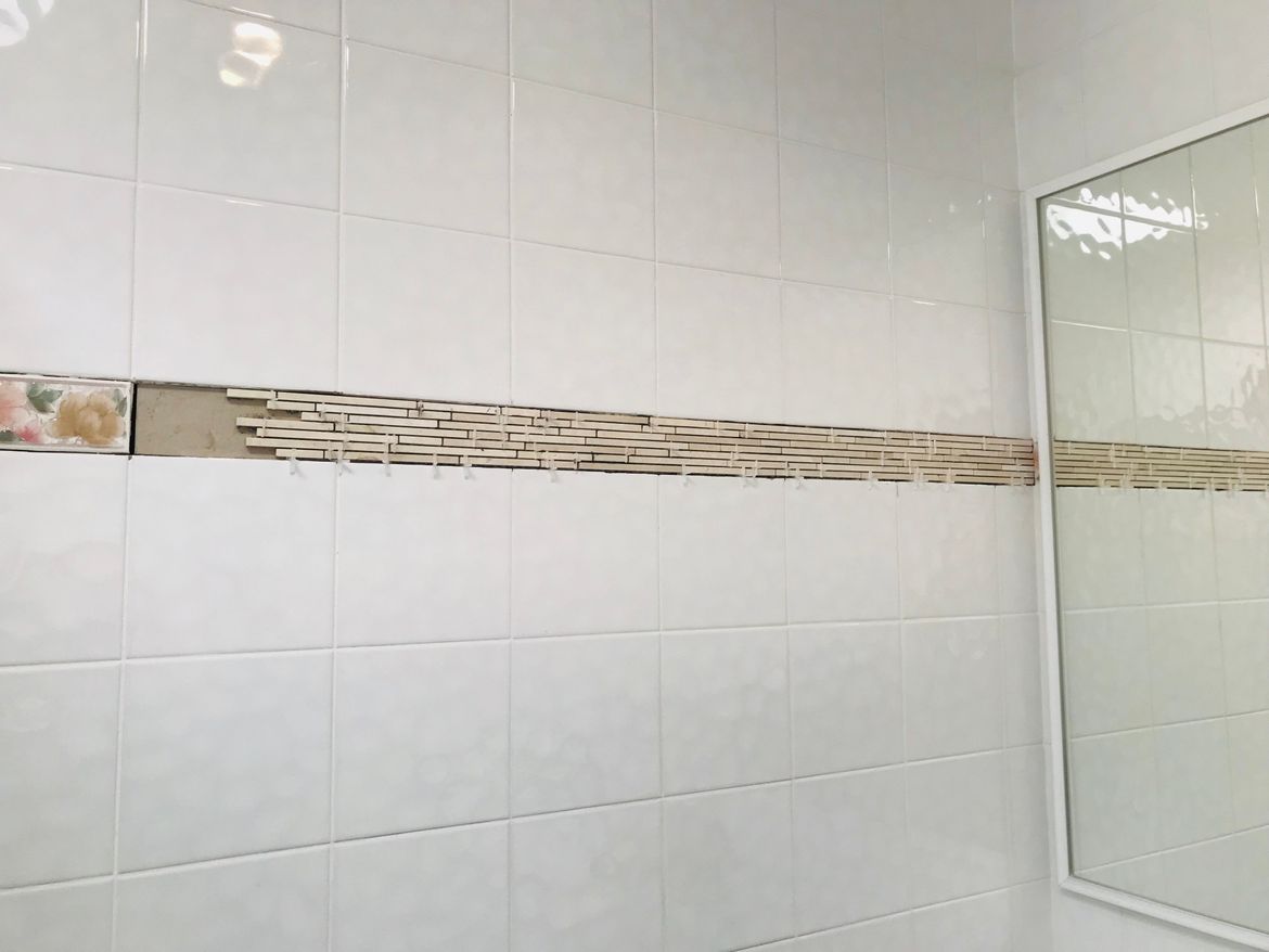 Tiles added to the new wall!