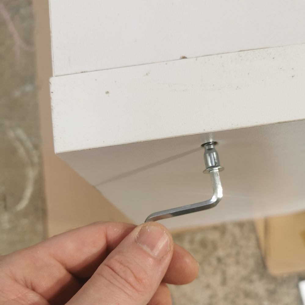 1.3 Tightening fixings of storage unit.png