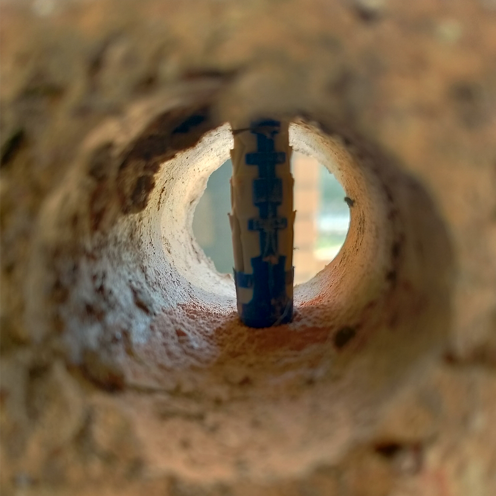 Step 3.5. Plastic plug positioned in drill hole.png