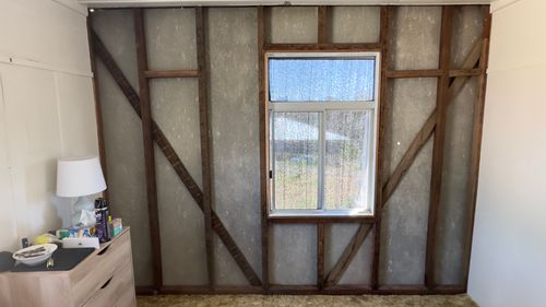 Wall be gone. Look at those studs!