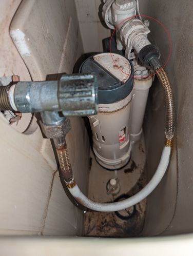 Old flush valve with clip holding inlet