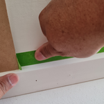 Step 2.6 Use thumb to secure tape..png