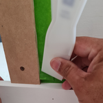 Step 3.2 Push second strip corner tape down with scraper.png