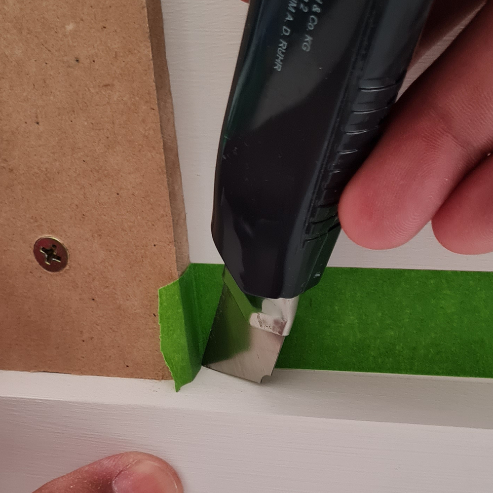 Step 2.7 Use utility knife to cut excess tape..png