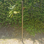 5.1 Stake driven into ground.png