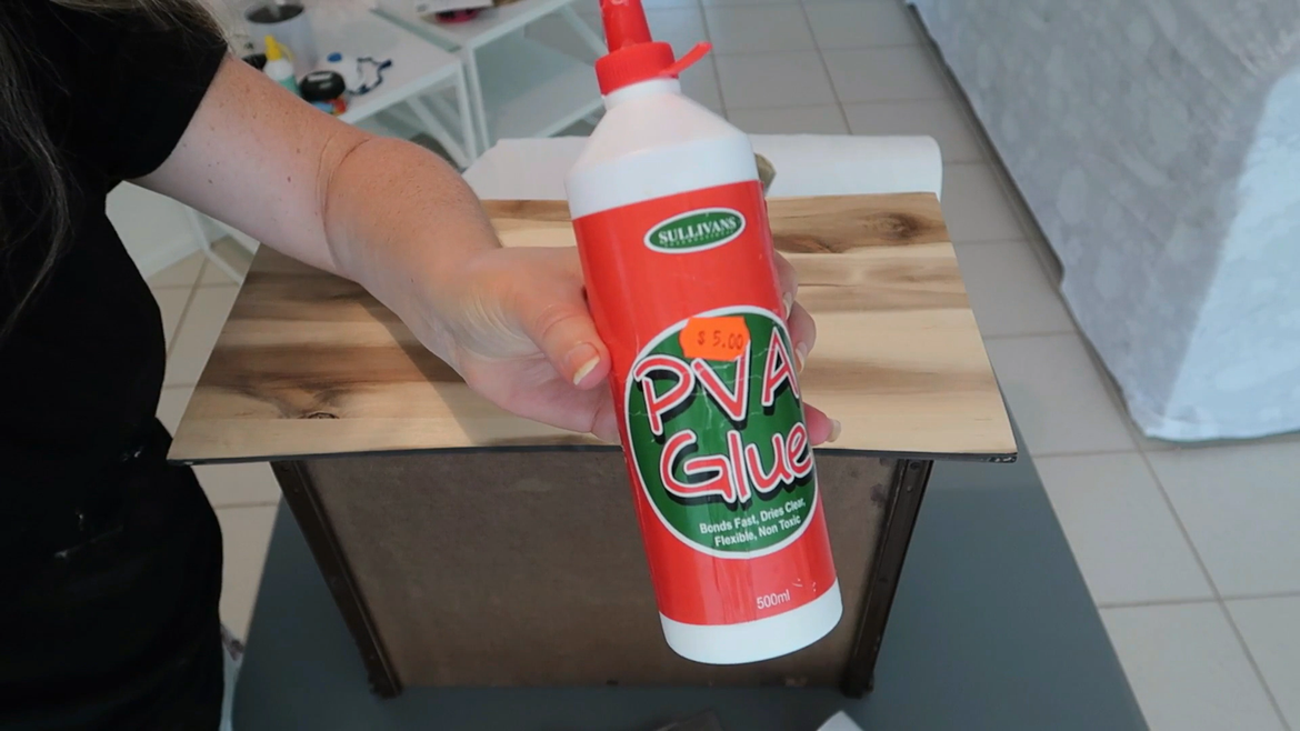 PVA glue works great when applying the textured vinyl to the panels.