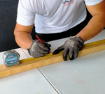 1.1 Use a tape measure to measure timber.png