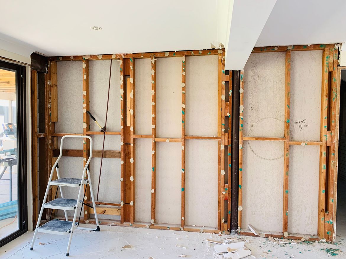 Wall skinned, but found a steel support pole. Will need to build a frame to front that wall.