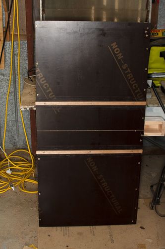 Crosscut sled from below showing runners and the open safety box.