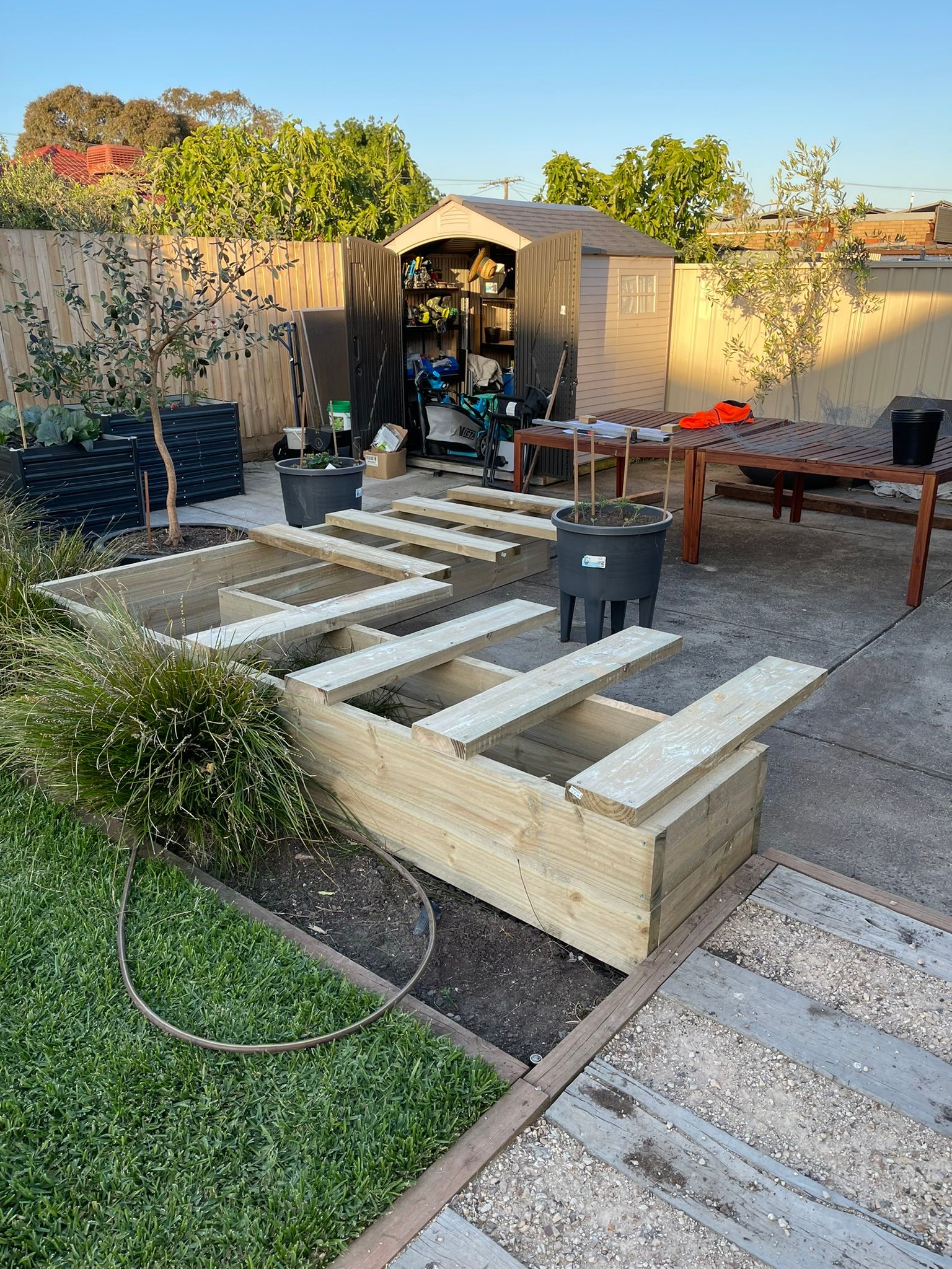 Outdoor seating with planter and storage Bunnings community