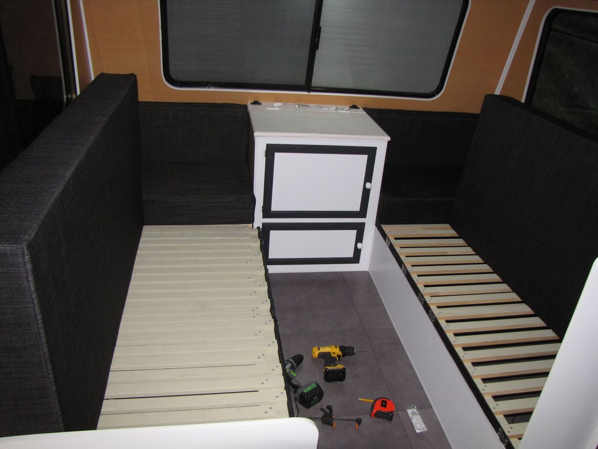 both sides hinged to access storage underneath