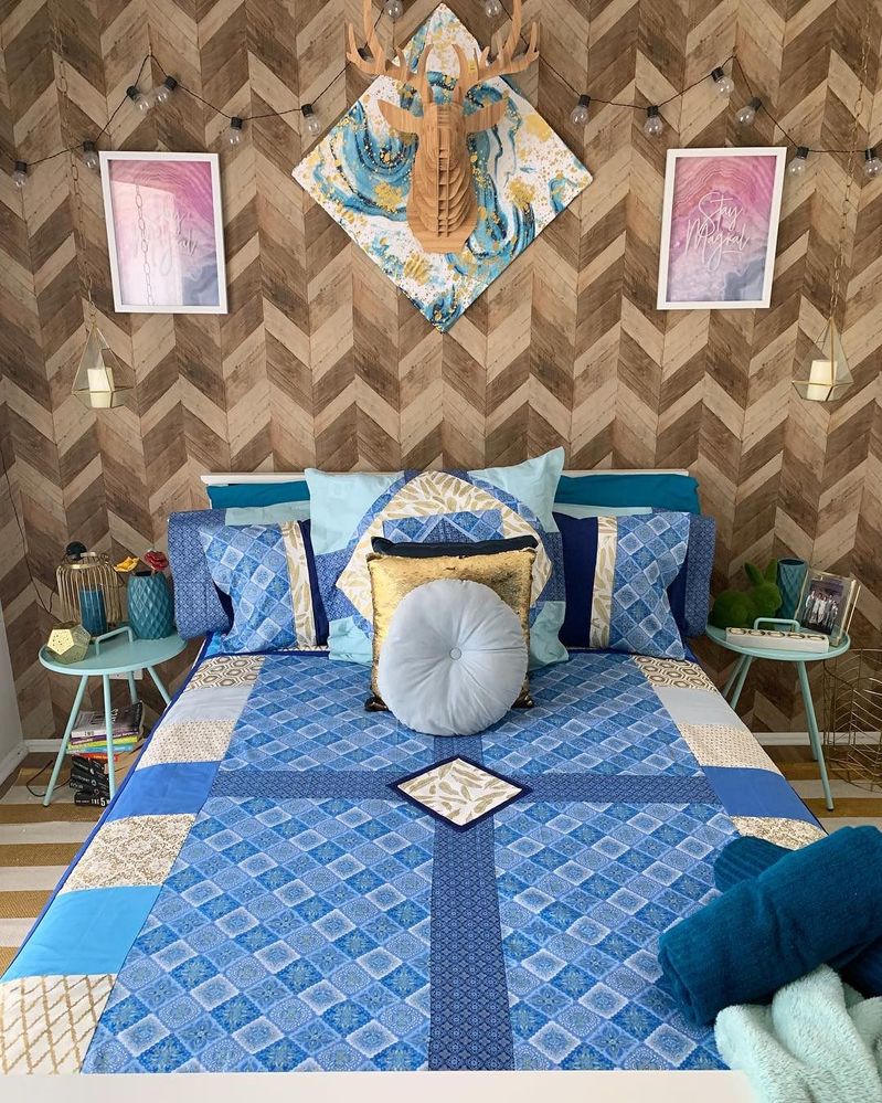 hand made quilt and cushions. wood look wallpaper