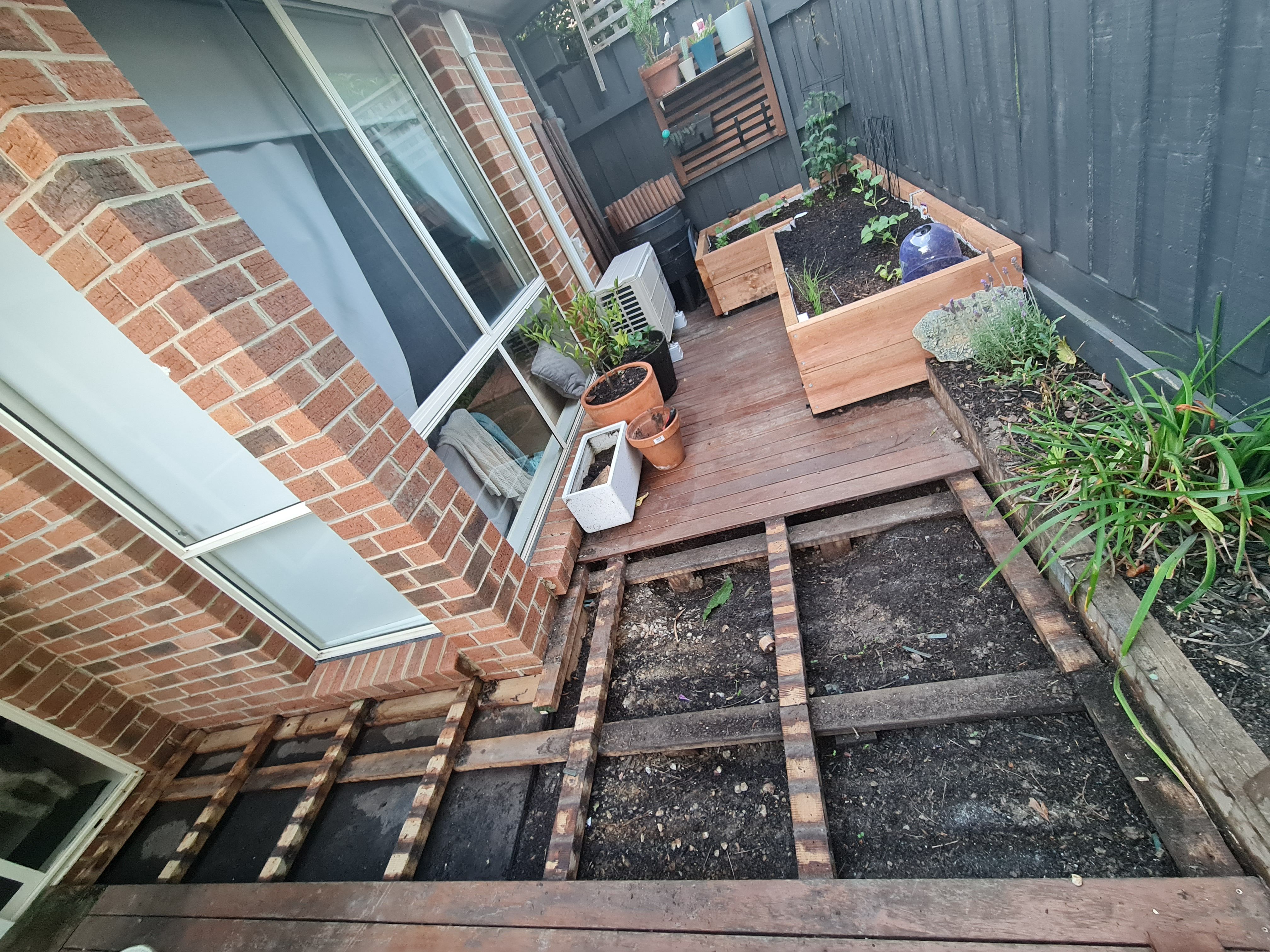 Sandpit with cover under existing deck Bunnings community