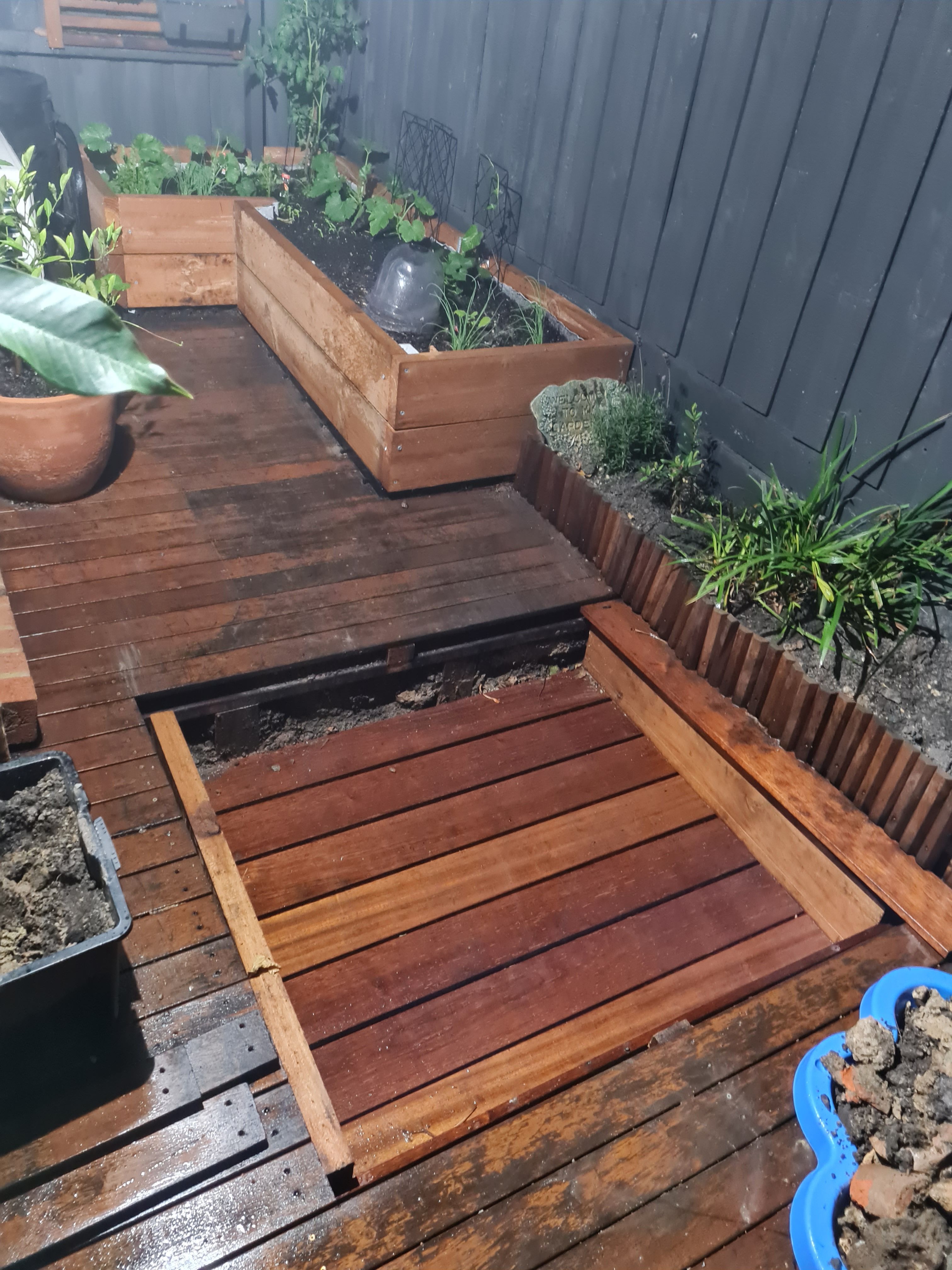 Sandpit with cover under existing deck Bunnings community