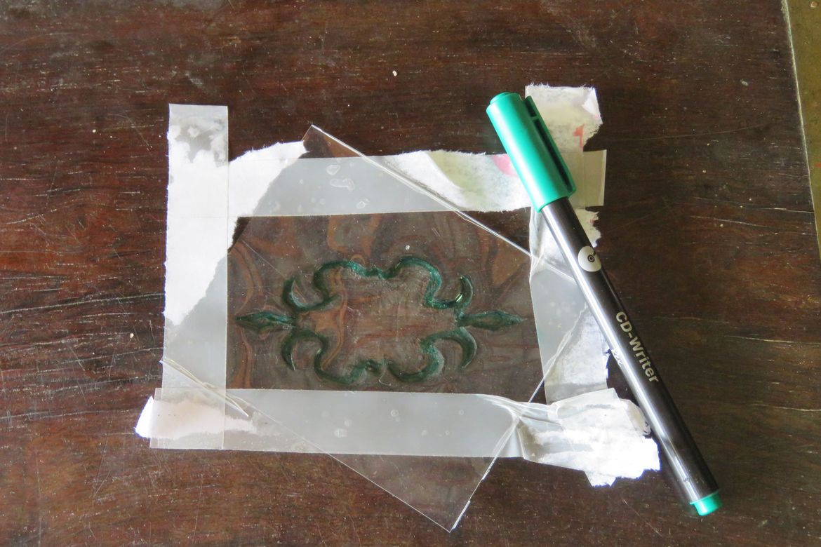 making a template with some clear plastic and a texta