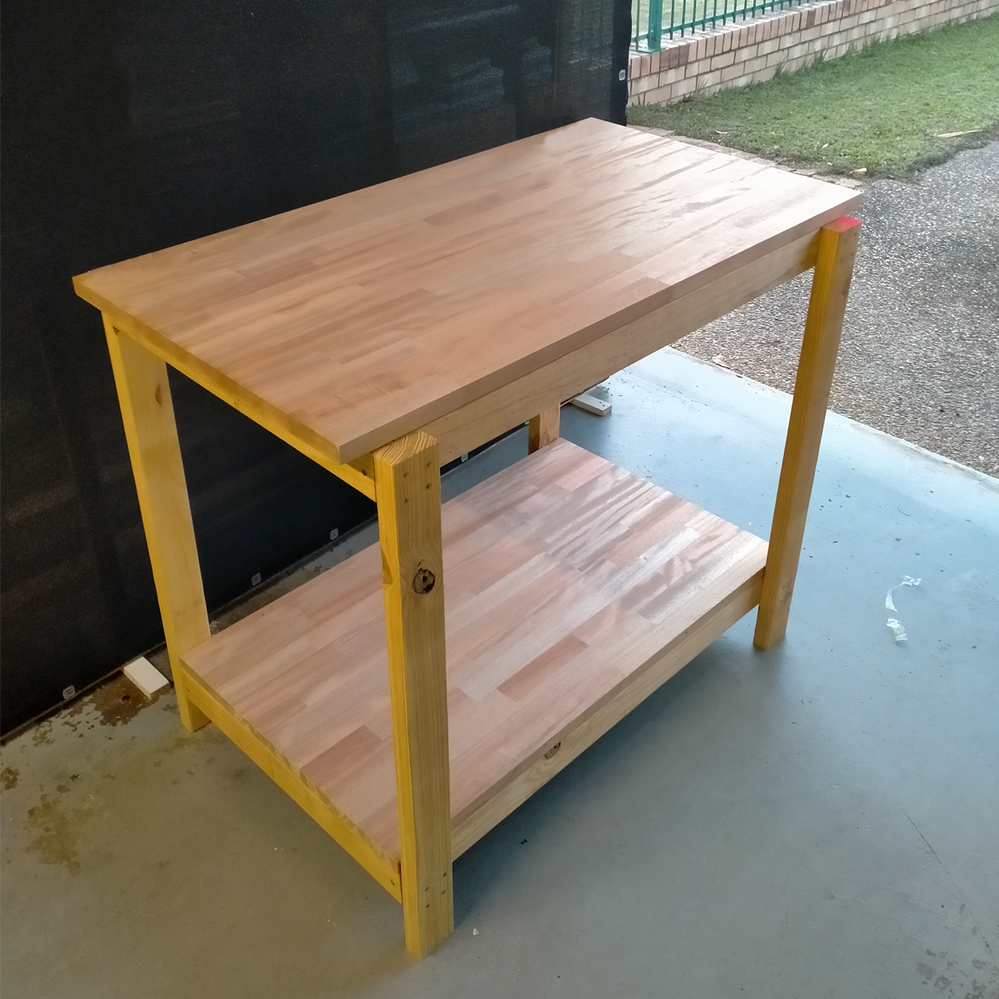 Step 4.6 Place benchtop on bottom and top shelf.png