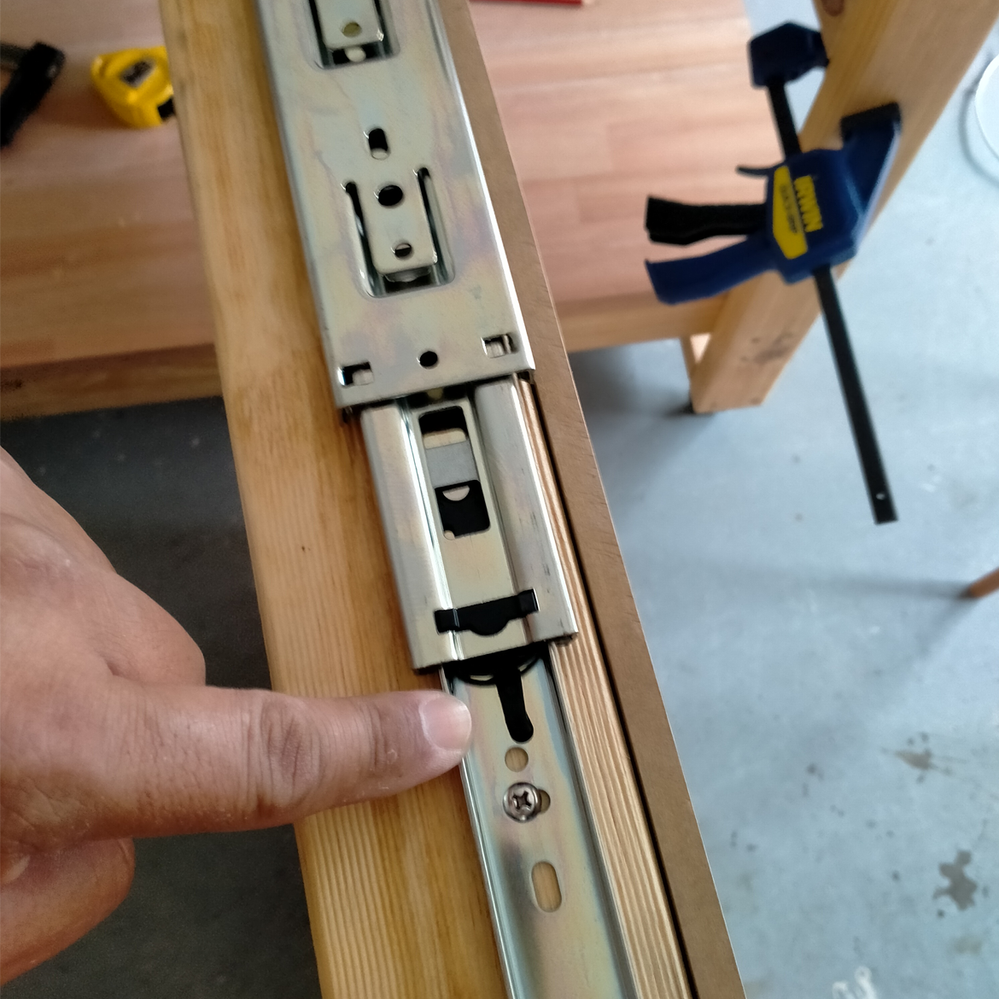 Step 7.3 Pull release clip down to remove drawer slide main body.png